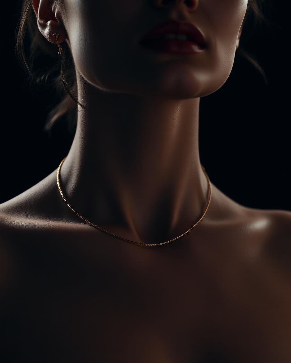 Model wearing a fine gold chain necklace